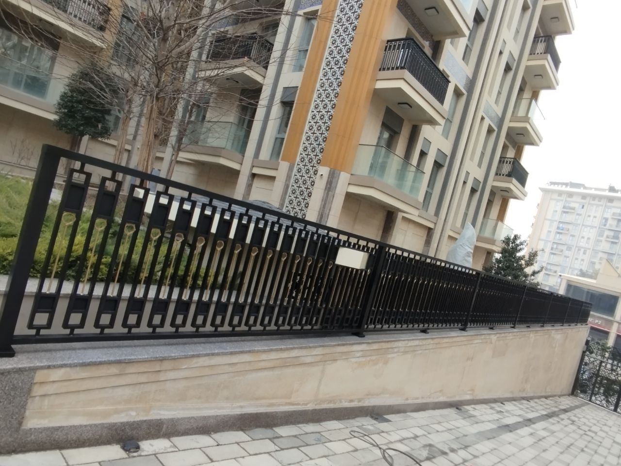 Decorative metal railing along a residential building